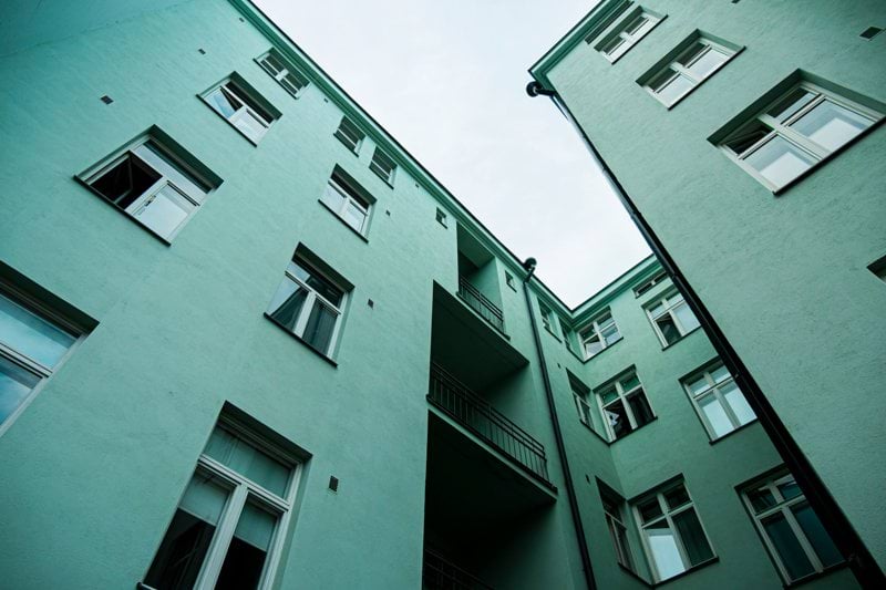 a couple of tall buildings sitting next to each other