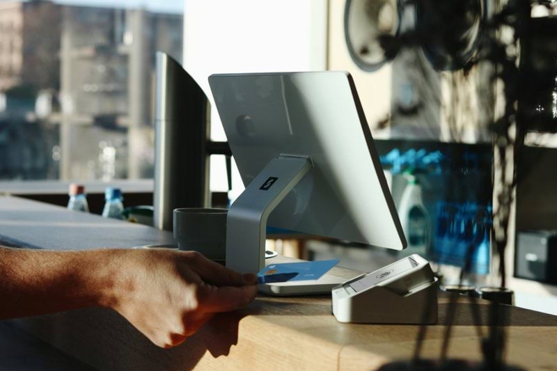 A man is sitting at a desk with a computer