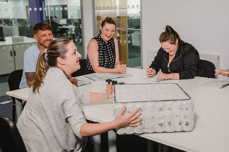 Group of people in a meeting having fun