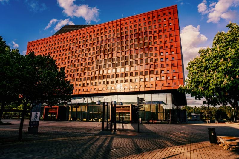 a large building with a parking lot