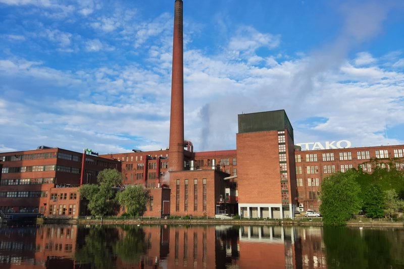 brown concrete building near body of water during daytime