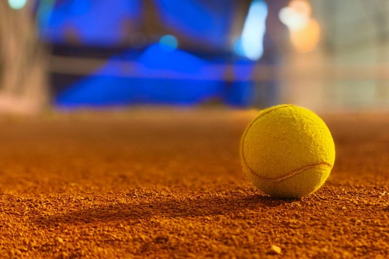 selective focus photography of tennis ball
