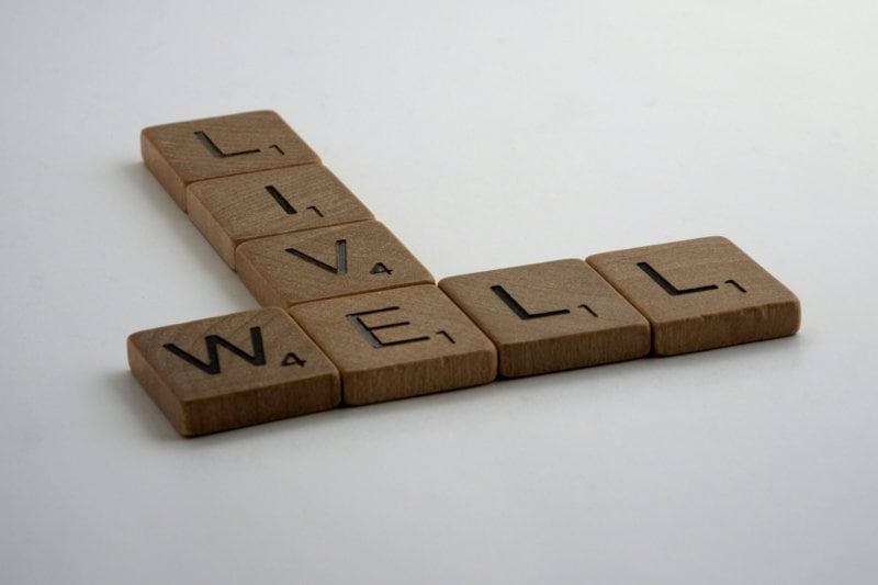 brown wooden letter blocks on white surface