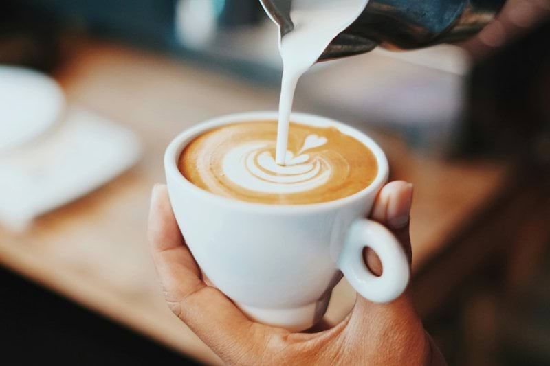 person making latte art