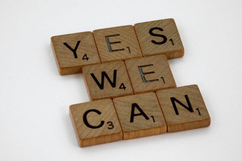 brown wooden letter blocks on white surface