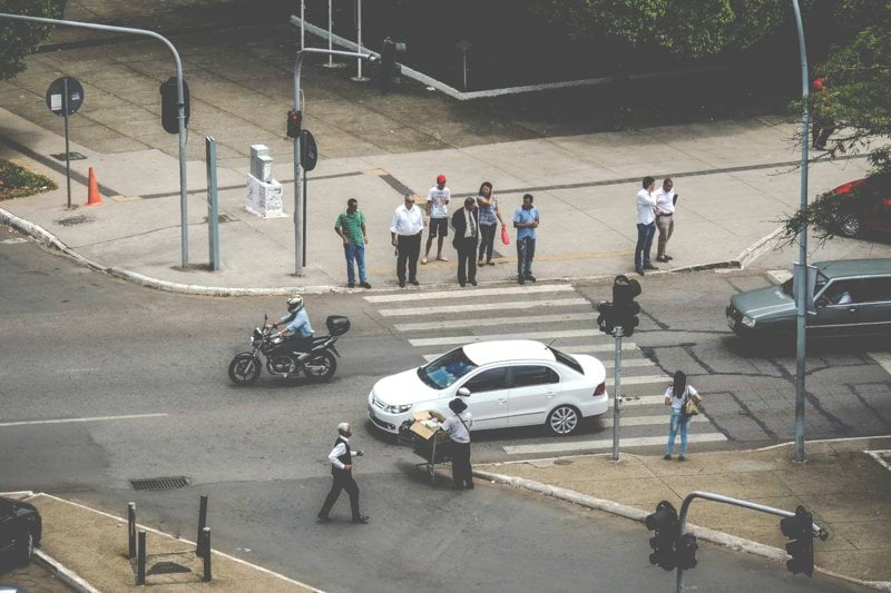 white car on ped xing