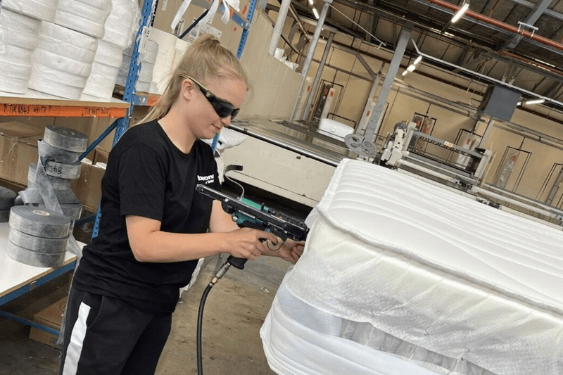 Female apprentice in manufacturing role