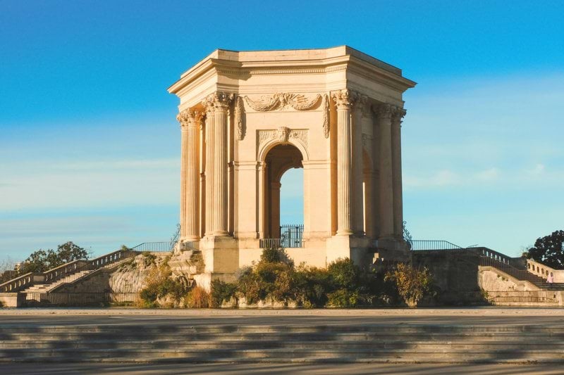 a large monument with a clock on top of it