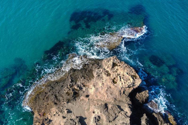 brown rocky shore during daytime