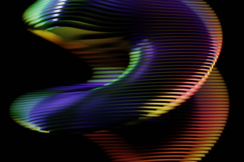 An abstract image of a woman's body with a black background