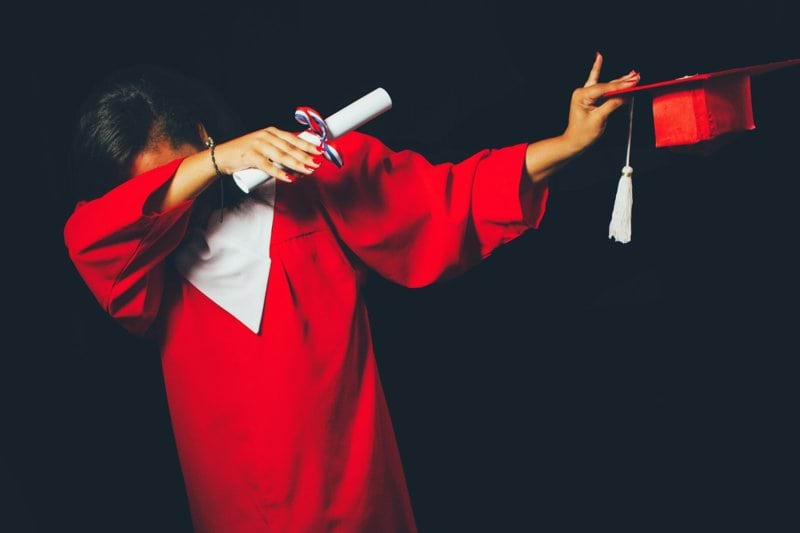 person wearing red graduation dress