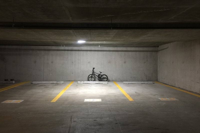 black motorcycle parked on tunnel