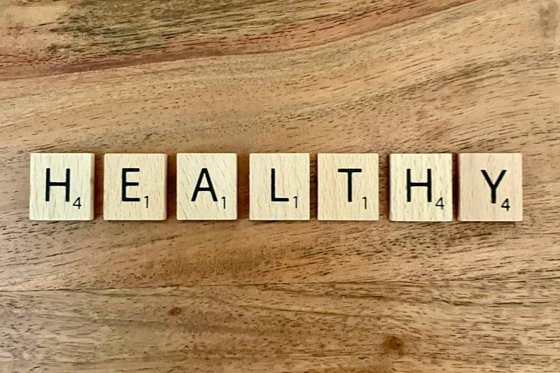 a group of white boxes with black text on a wooden surface