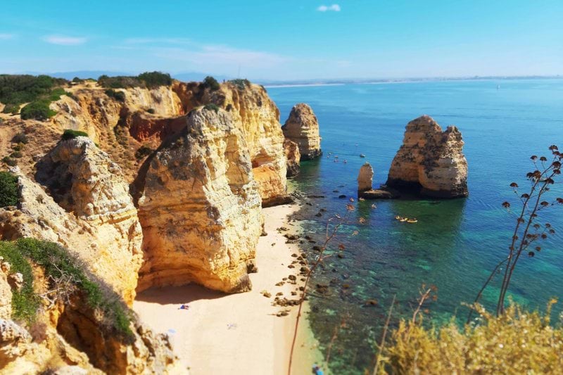 brown rock formation on sea during daytime