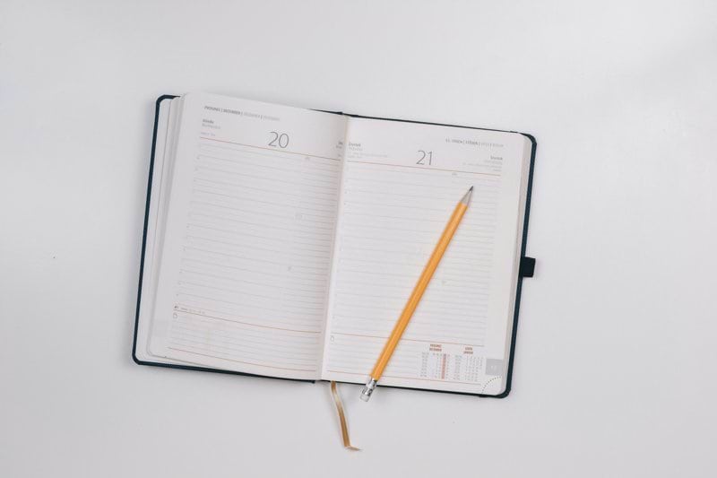 pencil on opened notebook