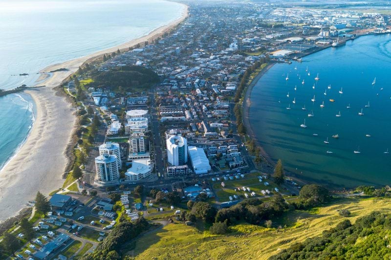 a bird's eye view of a city by the water