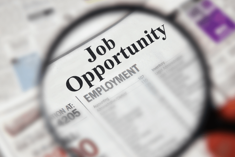 Photo of newspaper headline reading 'Job Opportunity'
