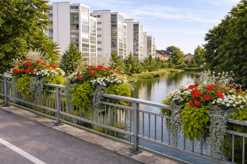 Flowers over a canal bridge in Angelhom, Sweden.