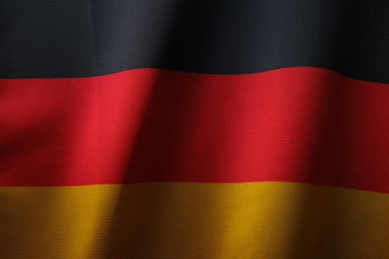 the flag of germany is waving in the wind
