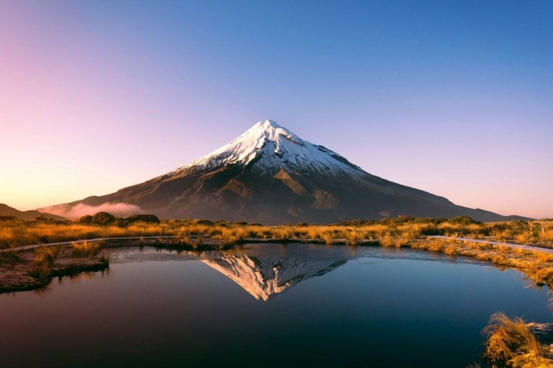 mountain near body of water during daytime
