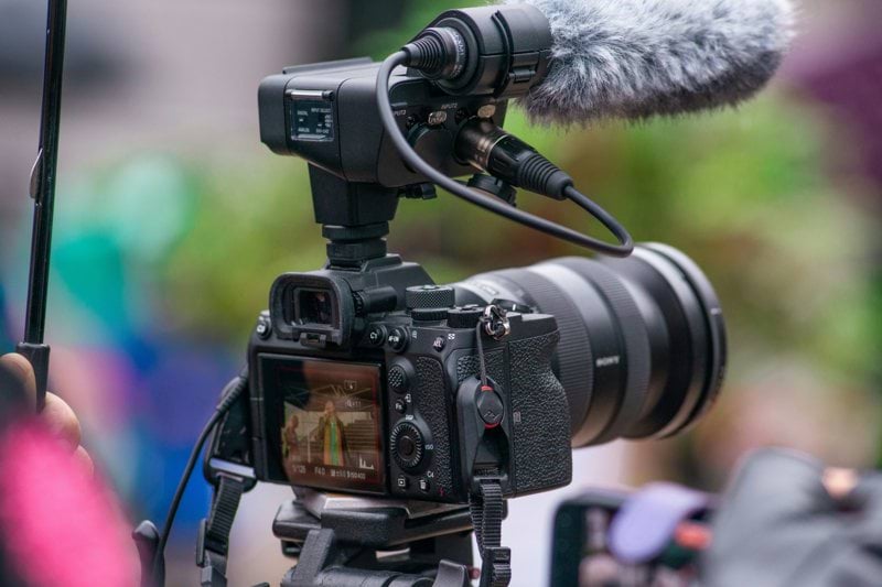 a camera with a microphone attached to it