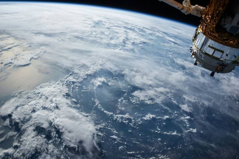view of Earth and satellite