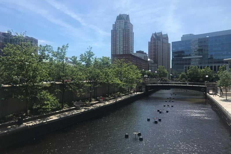 body of water near high-rise buildings