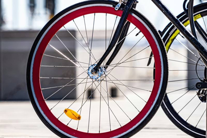 A close up of a bike parked on a sidewalk