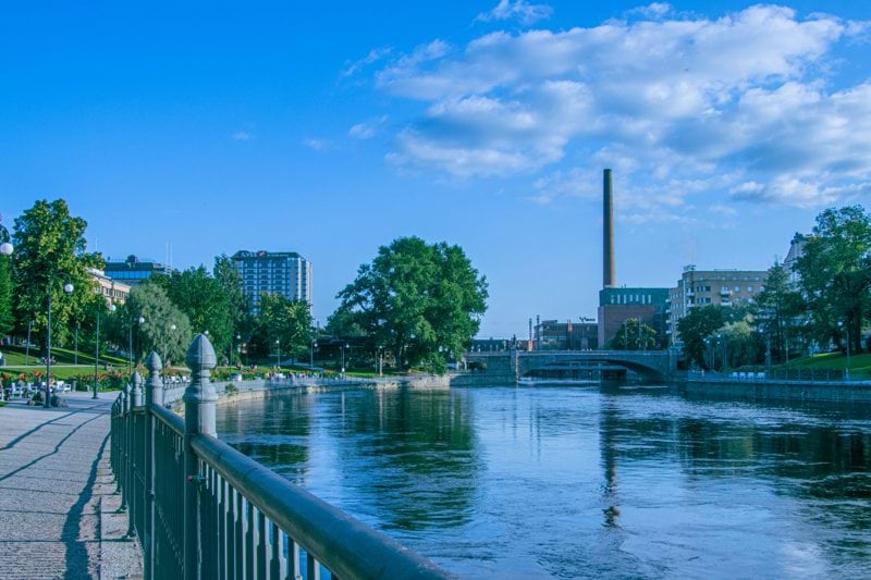 a river running through a city next to a bridge