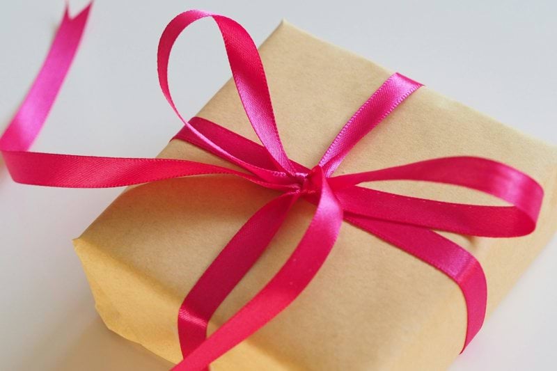 brown gift box with pink ribbon