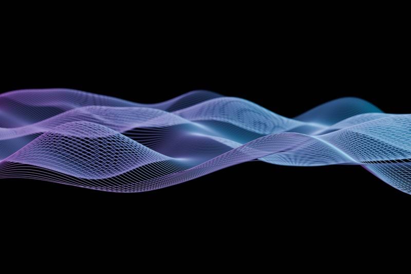 a blue and purple wave on a black background