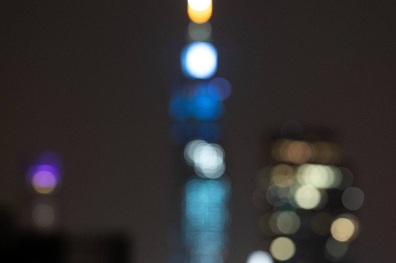 a blurry photo of a city at night