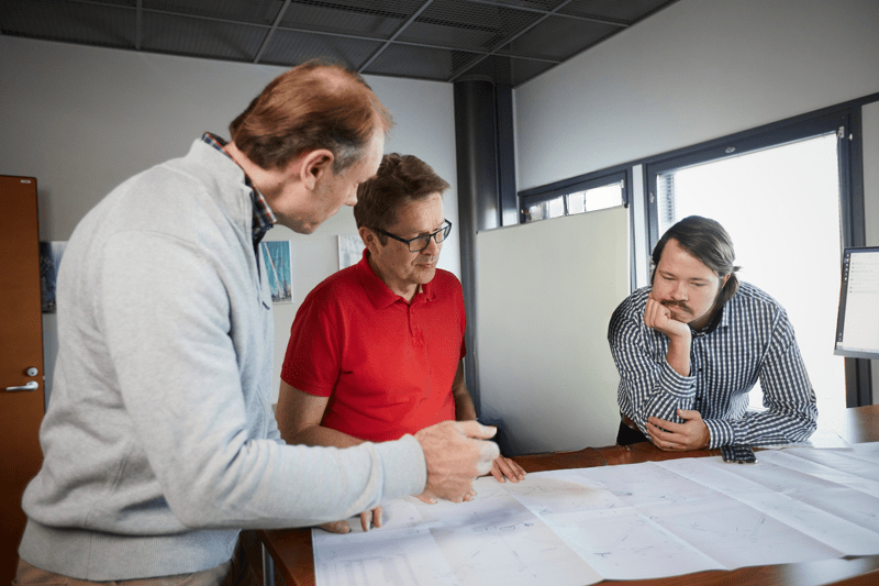 Designer with blueprints