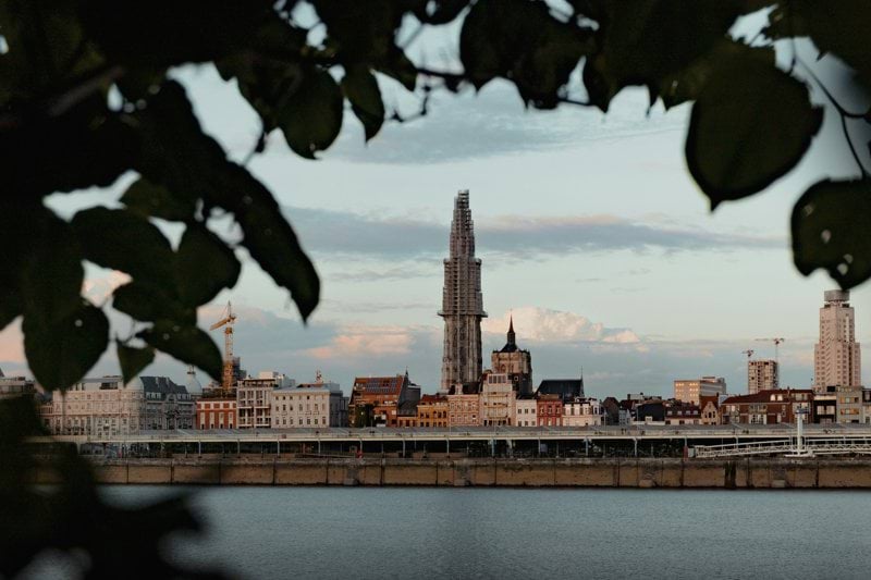 city skyline across body of water during daytime