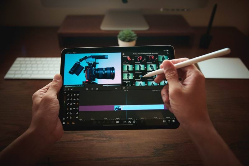 person holding black tablet computer