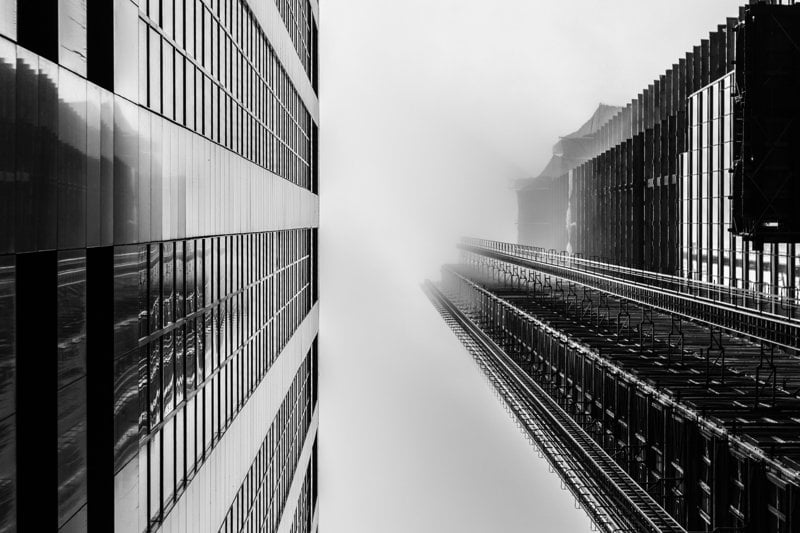 a black and white photo of tall buildings