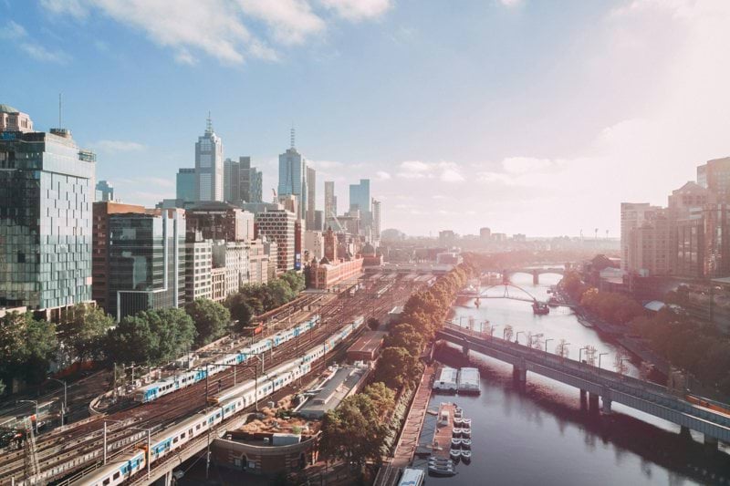 city buildings near body of water during daytime