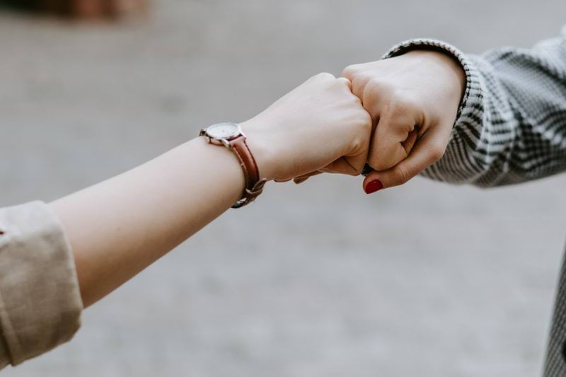 person wearing silver bracelet and bracelet