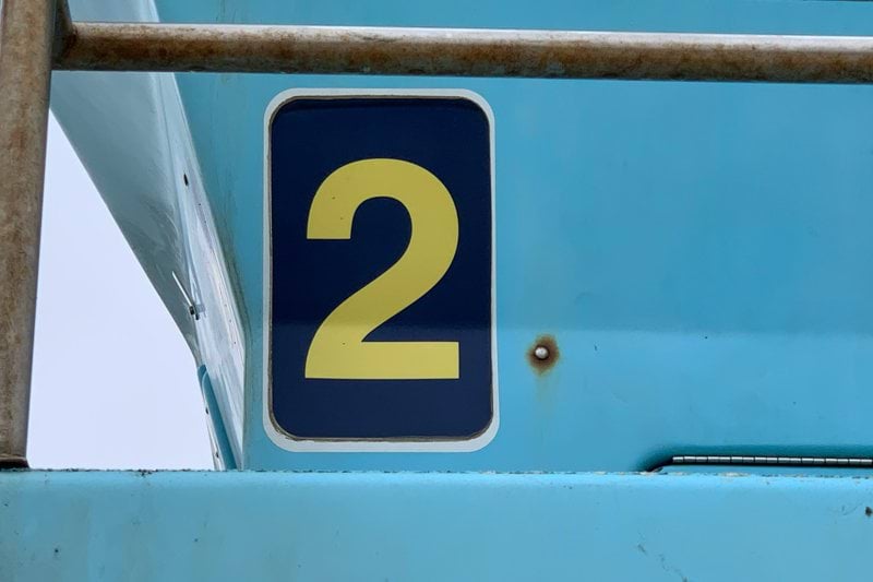 blue and white number 5 sign