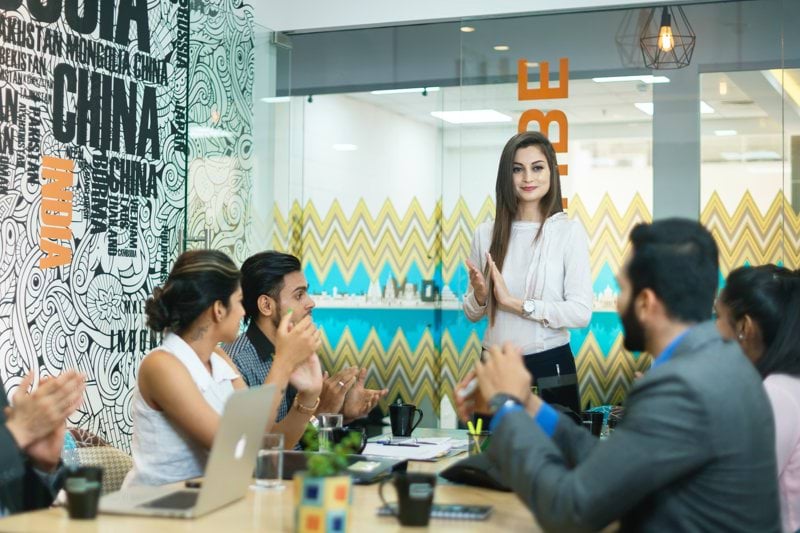 men and women having a meeting