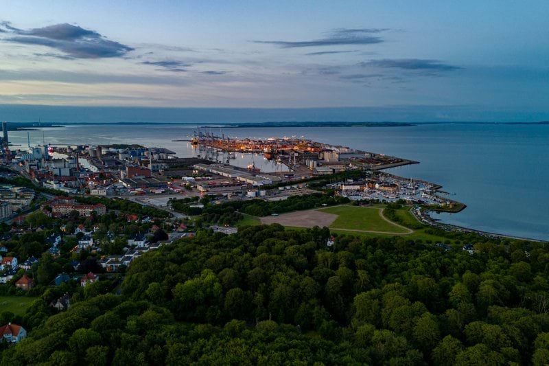 an aerial view of a city by the water