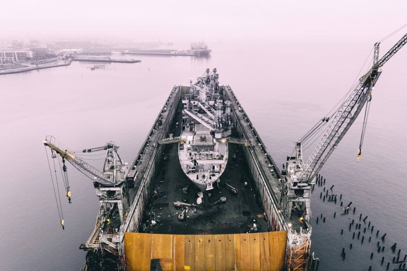 photo of ship on inside oil rig