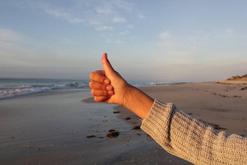 a hand on a beach