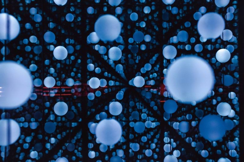 a group of blue balls floating in the air
