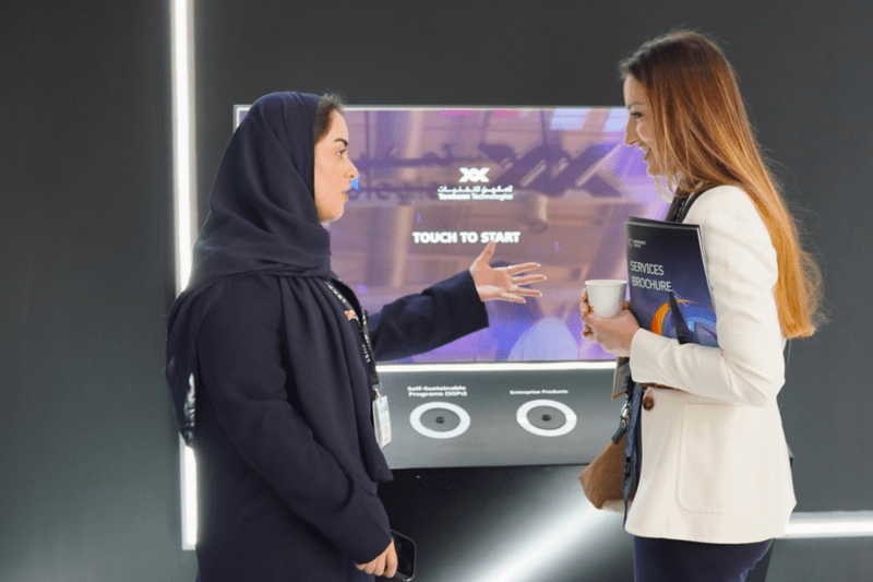 Two women conversating. One is expressing using her hands