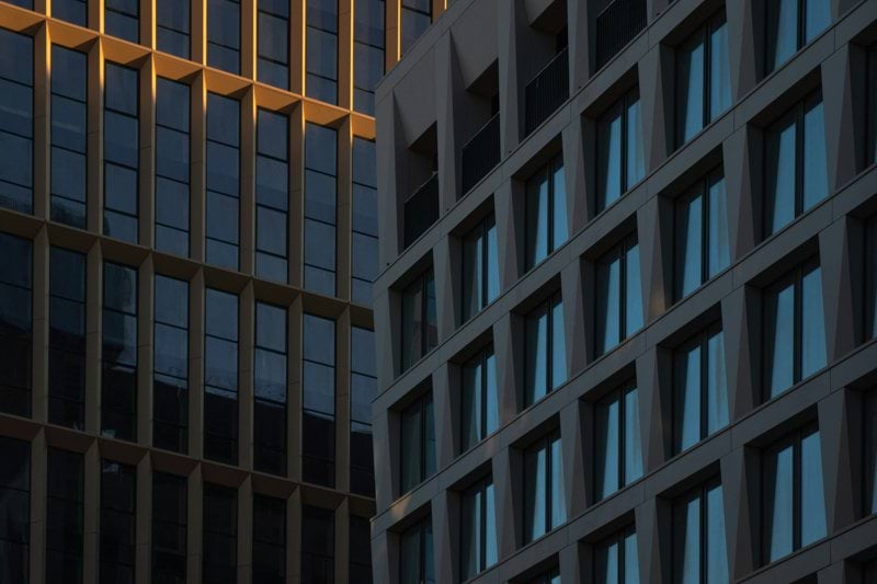 A close up of a clock on a building