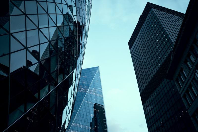 a couple of tall buildings next to each other