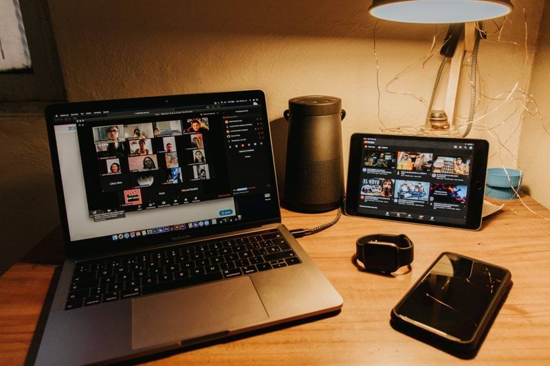 black and silver laptop computer on brown wooden table