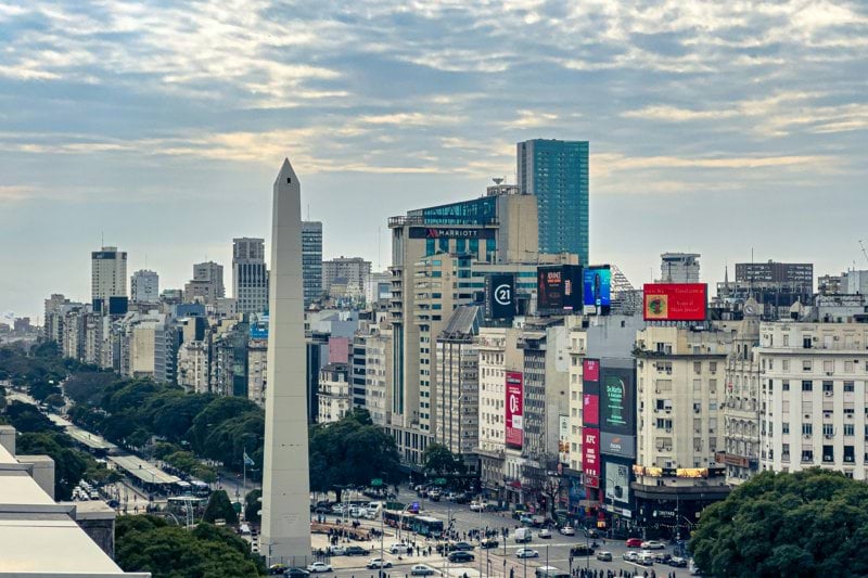 A view of a city with tall buildings and a obelisk