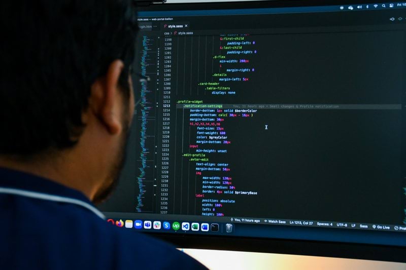 a man looking at a computer screen